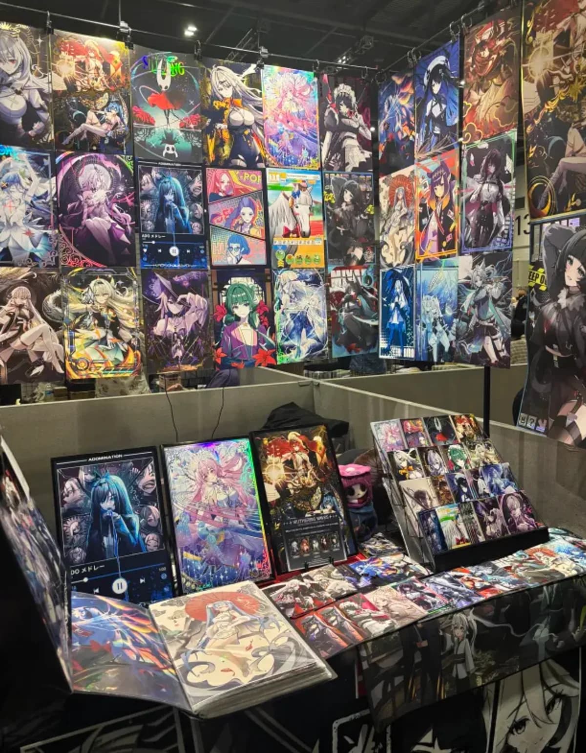 Booth print wall and table of framed prints