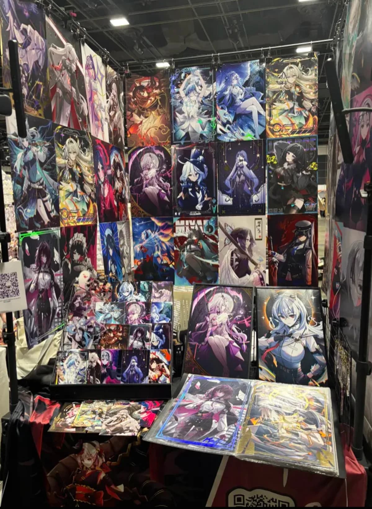 Full booth wall of prints with display table